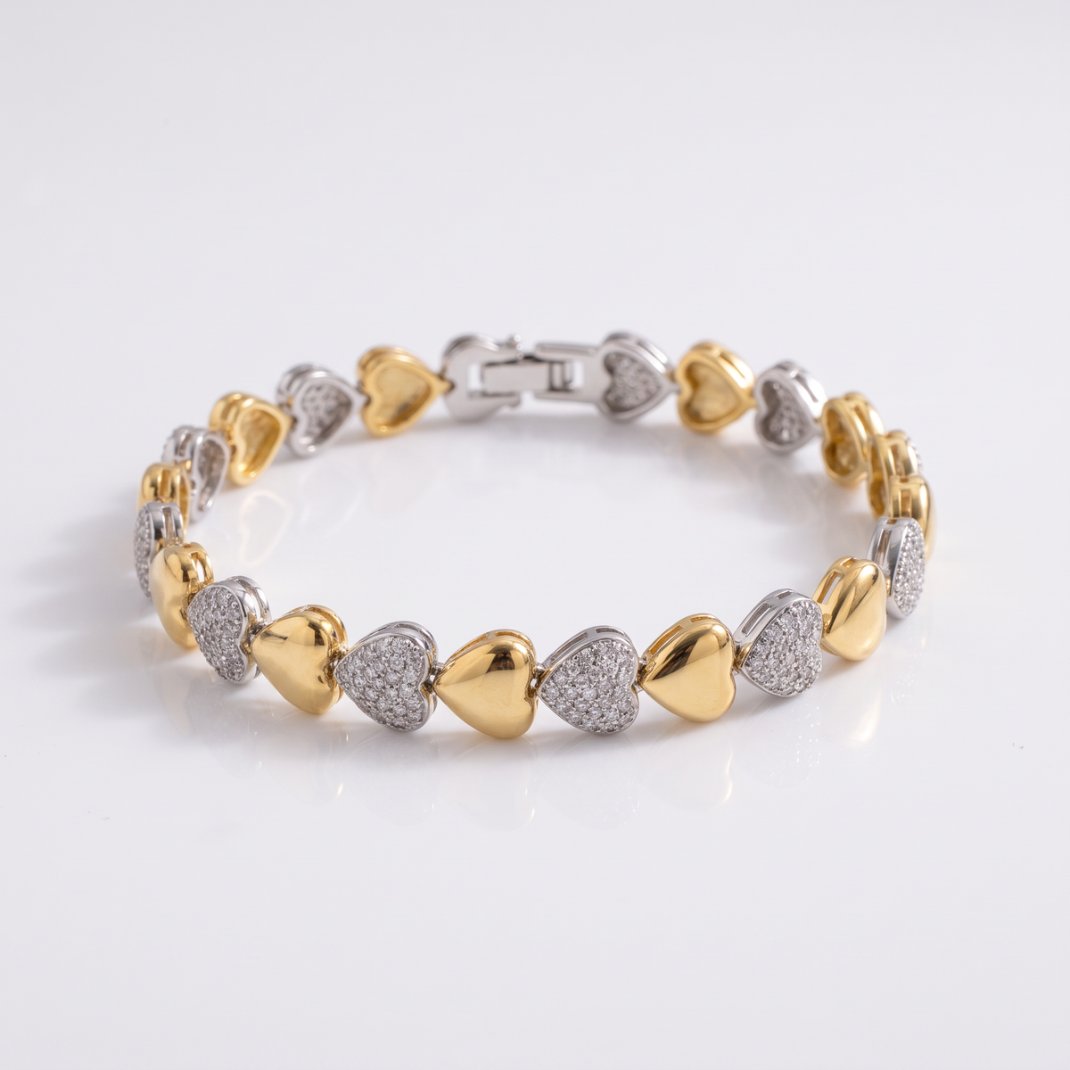 PULSEIRA CORAÇÕES COM DETALHES CRAVEJADOS E MIX DE BANHOS
